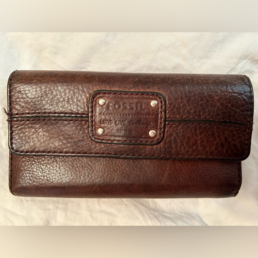 Fossil dark brown leather wallet with detachable checkbook holder.